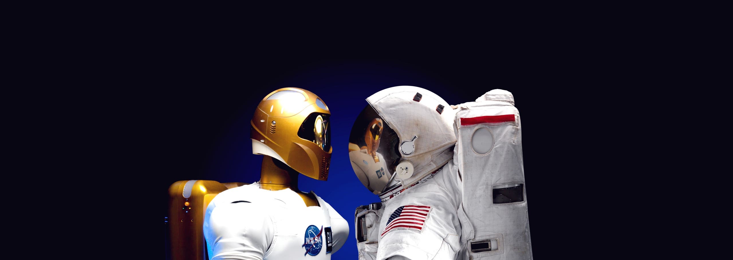 Robonaut and astronaut facing each other background image